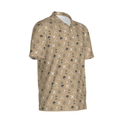 Safari Club Polo in tan with subtle giraffe print, buttoned collar, embroidered logo.